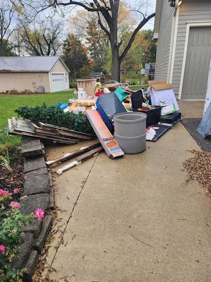 Dumpster being loaded with debris for Roofing Dumpster Rental in Rio del Mar